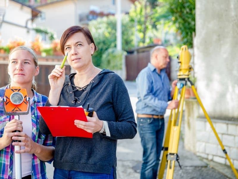 Survey professionals documenting property information where an ALTA survey supports long-term commercial ownership transitions.